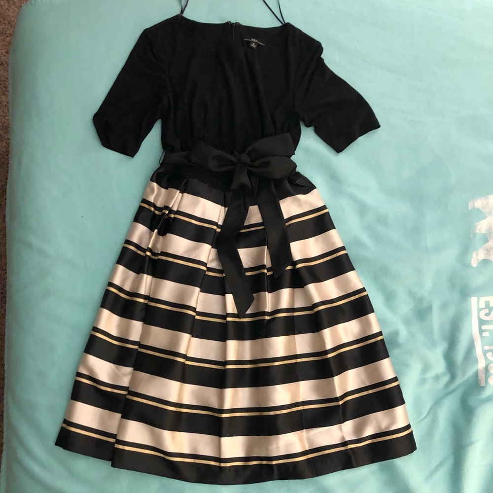 R&K black dress with stripe skirt attached.